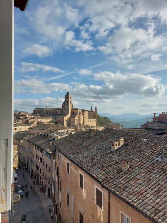 a view of a city from the roofs of buildings at Il cielo di Raffaello in Urbino