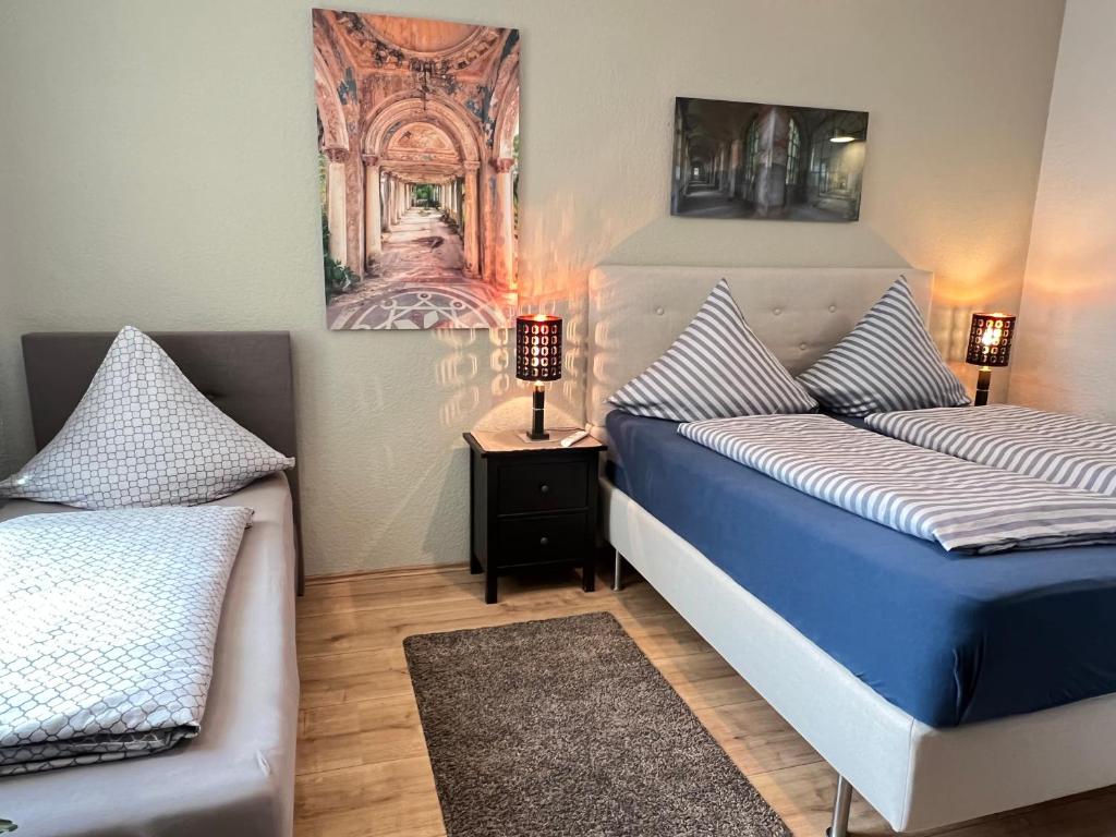 Postel nebo postele na pokoji v ubytování Pension-Leipzig-Süd