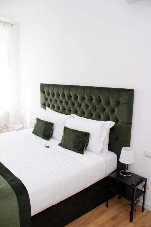 A bed or beds in a room at Home at Rome St. Peter Guest House