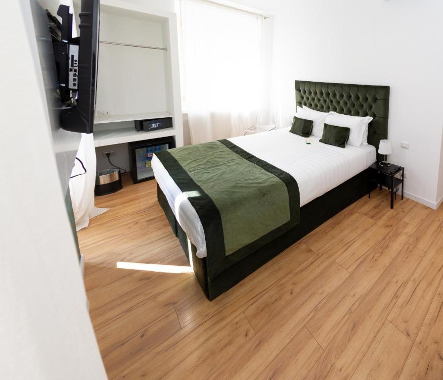 A bed or beds in a room at Home at Rome St. Peter Guest House
