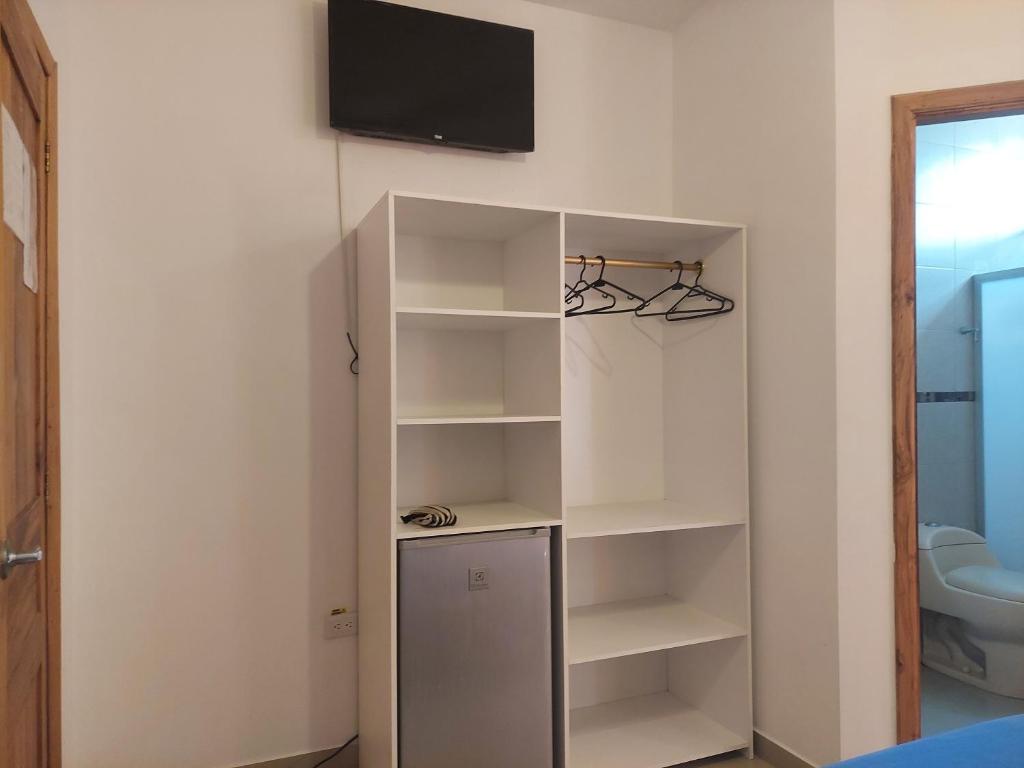 TV a/nebo společenská místnost v ubytování Hotel Almond Beach