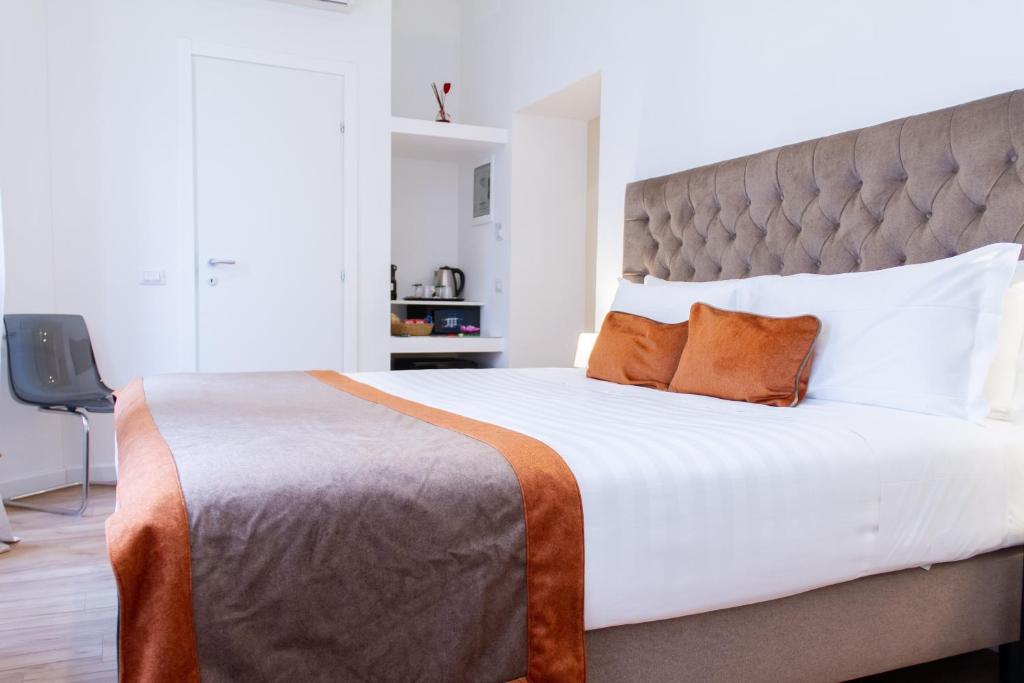 A bed or beds in a room at Home at Rome St. Peter Guest House