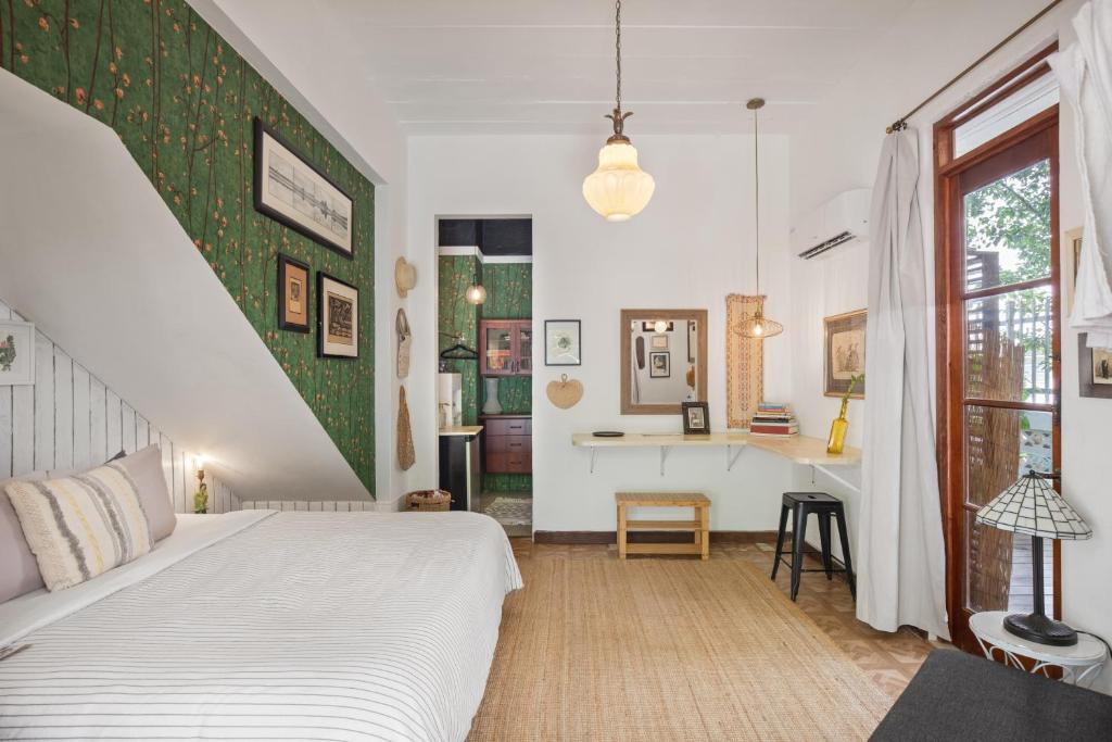Postel nebo postele na pokoji v ubytování La Botanica Hotel