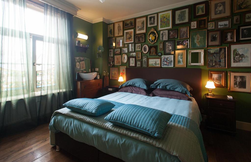 Postel nebo postele na pokoji v ubytování B&B De Lachende Engel