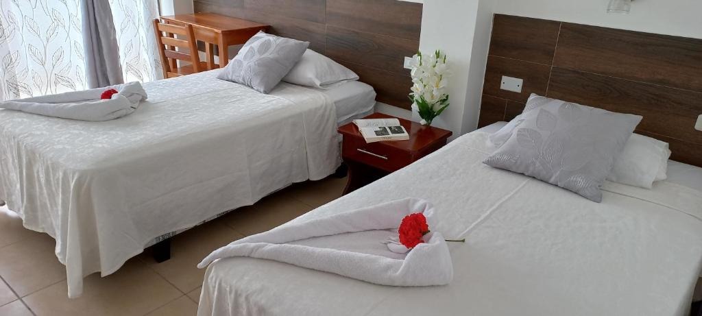 Postel nebo postele na pokoji v ubytování Hotel Sula Sula