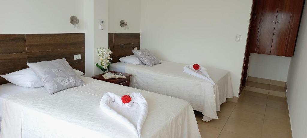 Postel nebo postele na pokoji v ubytování Hotel Sula Sula