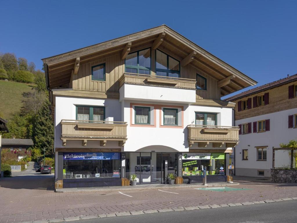 an apartment building with a wooden roof at Apartment Erich Brixen in Brixen im Thale