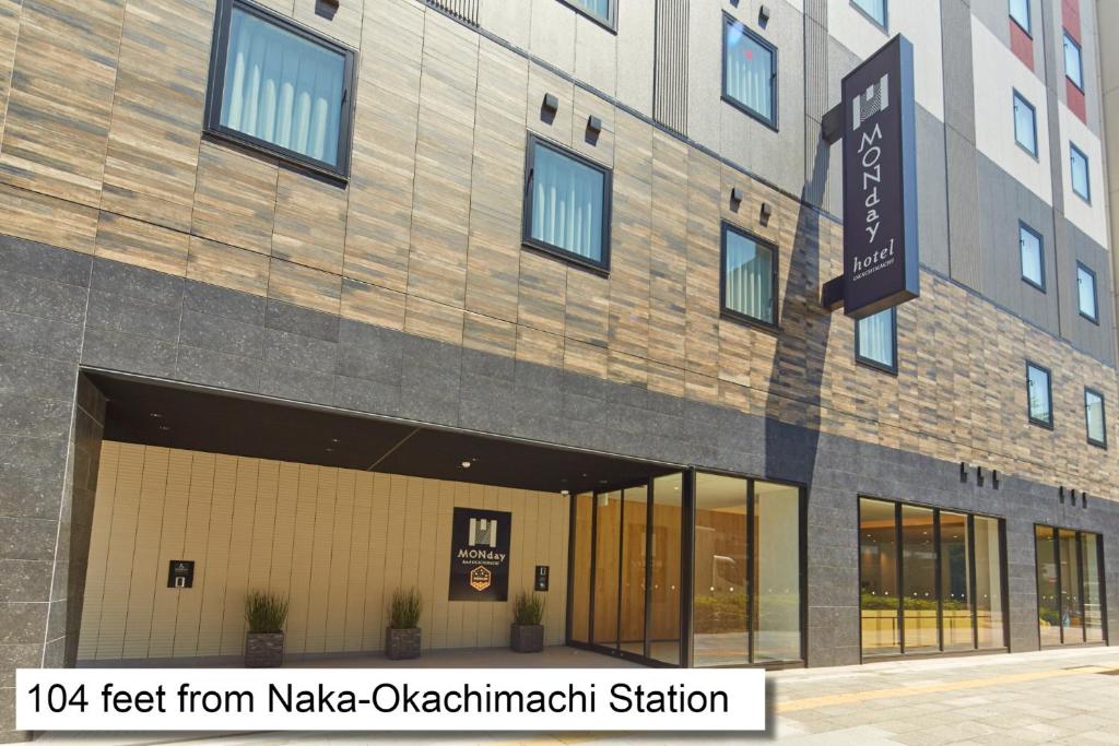 a building with a sign that reads feet from make ovation meditation station at hotel MONday Premium Ueno Okachimachi in Tokyo