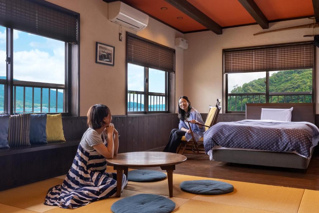 Postel nebo postele na pokoji v ubytování Tsuruga Sazanami Resort Chobei