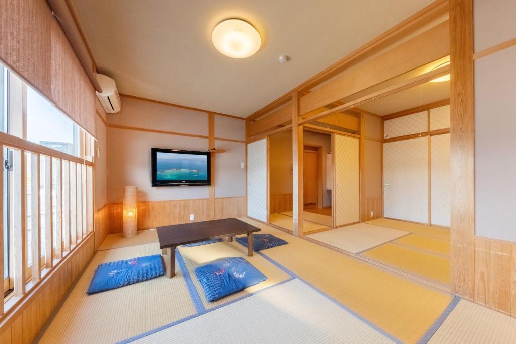 Postel nebo postele na pokoji v ubytování Tsuruga Sazanami Resort Chobei