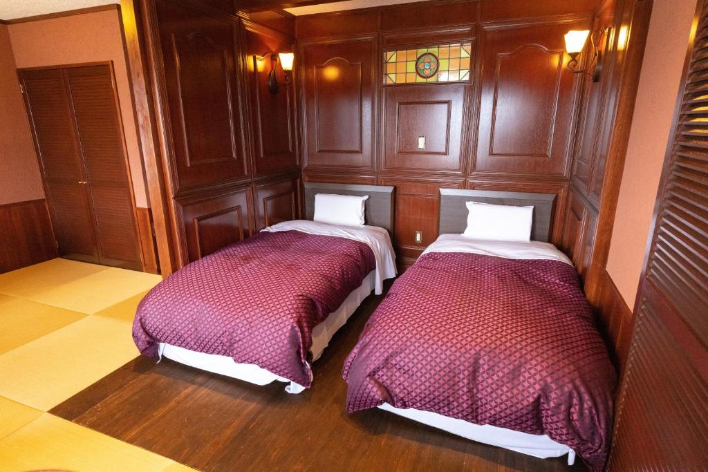 Postel nebo postele na pokoji v ubytování Tsuruga Sazanami Resort Chobei