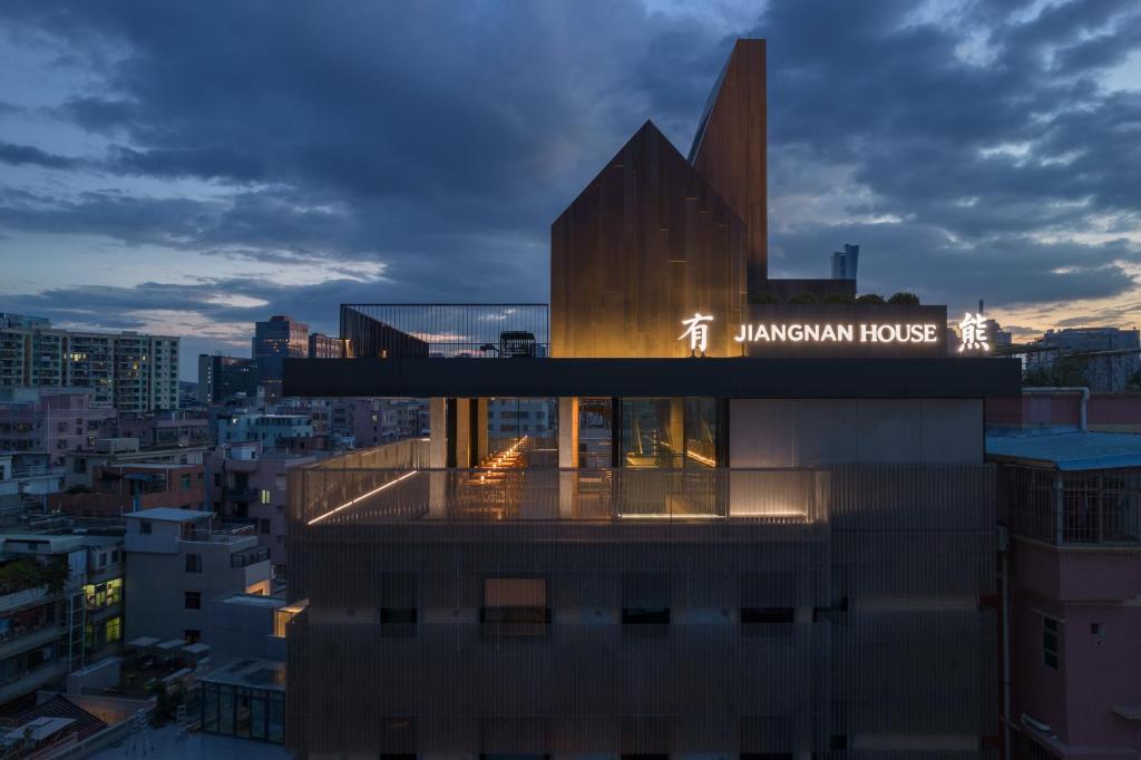 a building with a sign on top of it at Jiangnan House Nantou in Shenzhen