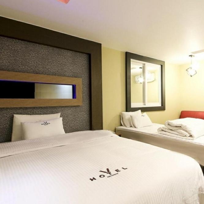 Postel nebo postele na pokoji v ubytování v motel