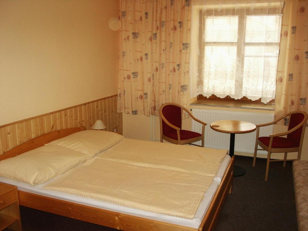Postel nebo postele na pokoji v ubytování Penzion Velke Darko