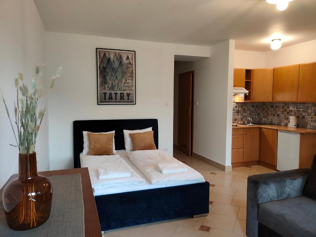 Ένα ή περισσότερα κρεβάτια σε δωμάτιο στο Apartament Holny