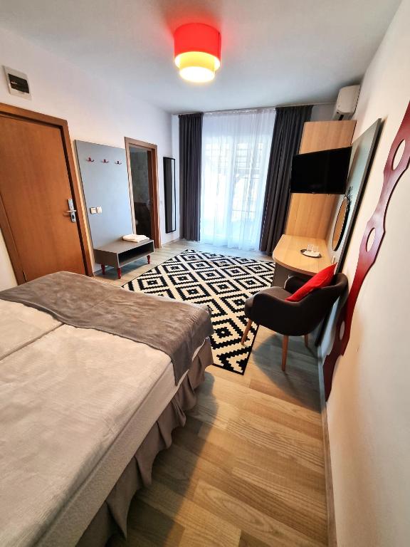 Postel nebo postele na pokoji v ubytování Motel Via Targu Mures
