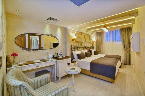 A bed or beds in a room at Yılsam Sultanahmet Hotel