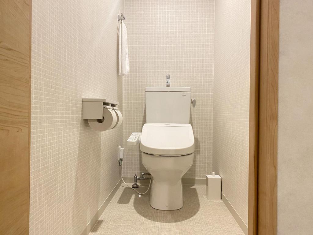 Koupelna v ubytování Takanobashi HOTEL