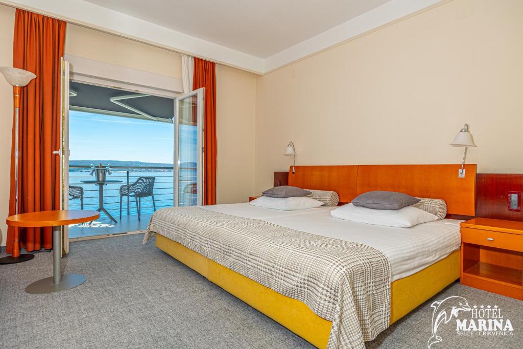 Postel nebo postele na pokoji v ubytování Hotel Marina