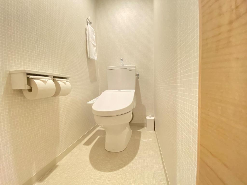 Koupelna v ubytování Takanobashi HOTEL