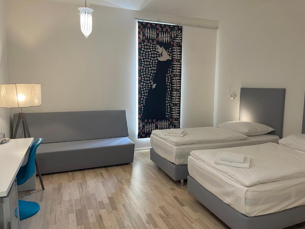 Postel nebo postele na pokoji v ubytování Hotel Praha Liberec