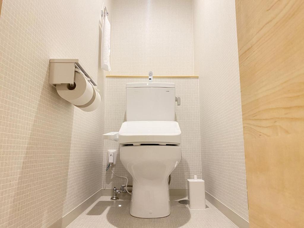 Koupelna v ubytování Takanobashi HOTEL