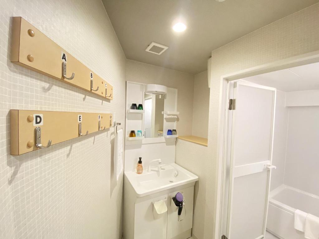 Koupelna v ubytování Takanobashi HOTEL
