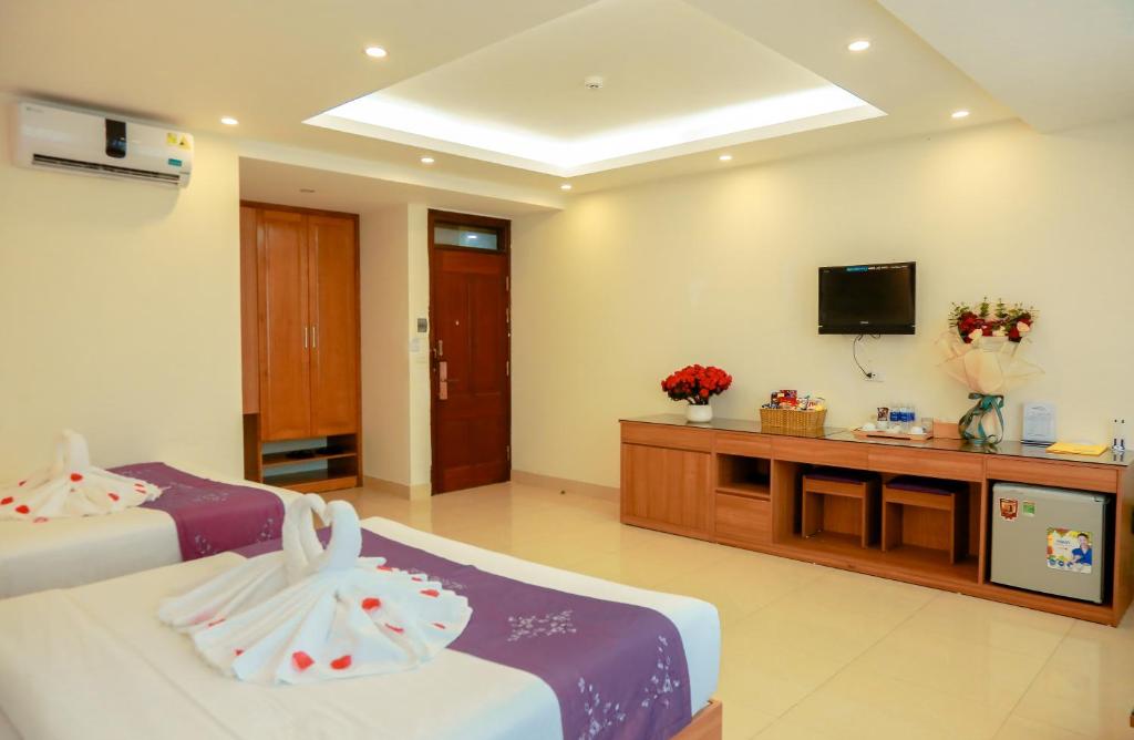 TV a/nebo společenská místnost v ubytování Aloha Hotel