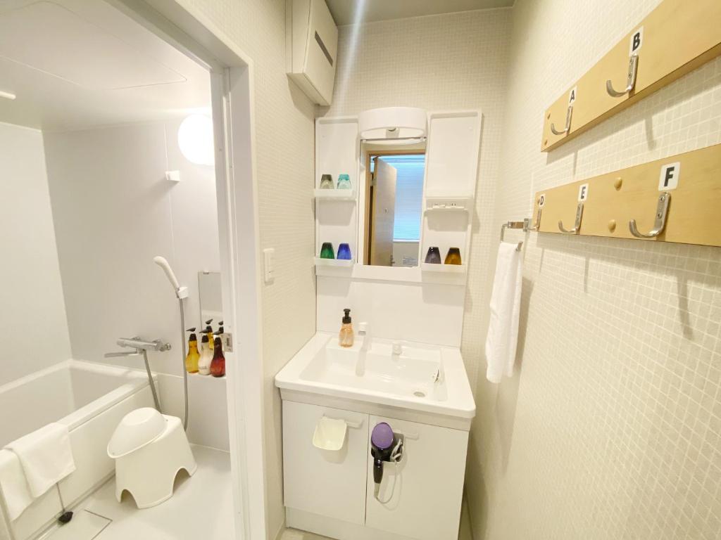 Koupelna v ubytování Takanobashi HOTEL