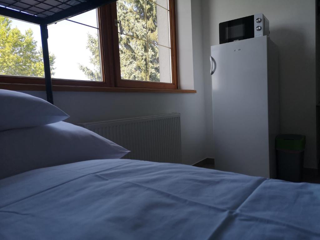 Postel nebo postele na pokoji v ubytování Ecostel Budaörs