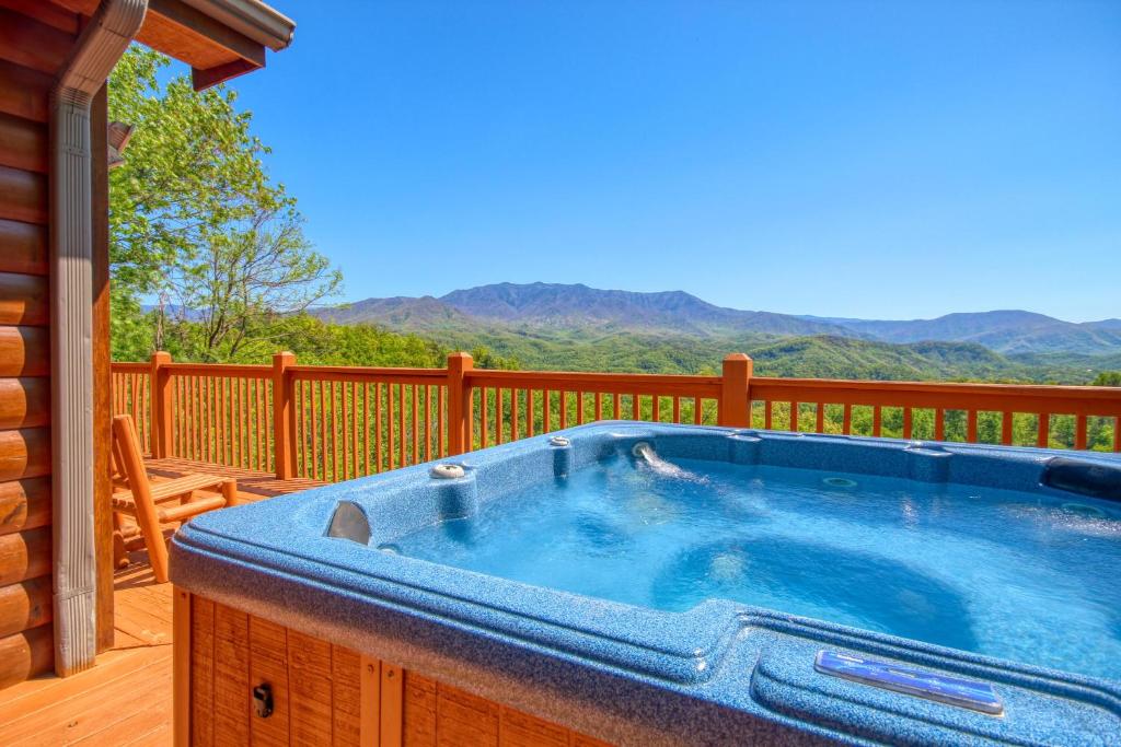 a hot tub on the deck of a house at Awesome Views #701 in Gatlinburg