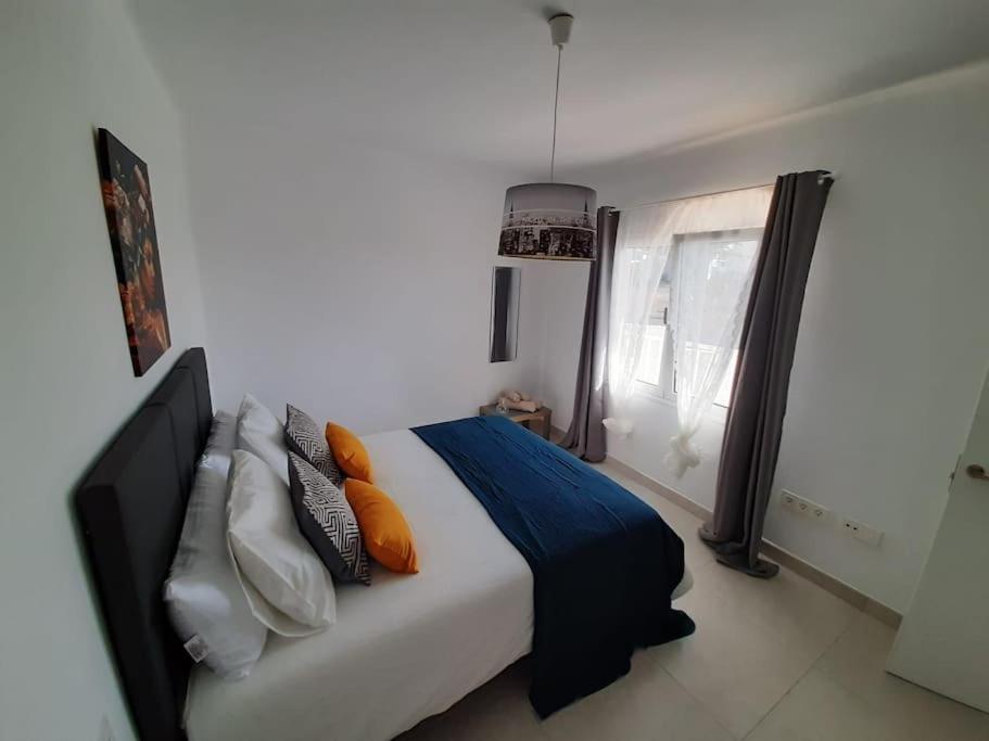 Posteľ alebo postele v izbe v ubytovaní Casa Amor Costa Teguise
