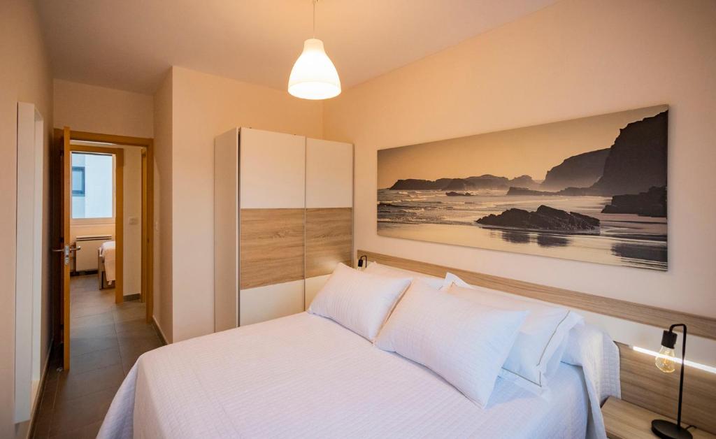 Postel nebo postele na pokoji v ubytování Area Suites