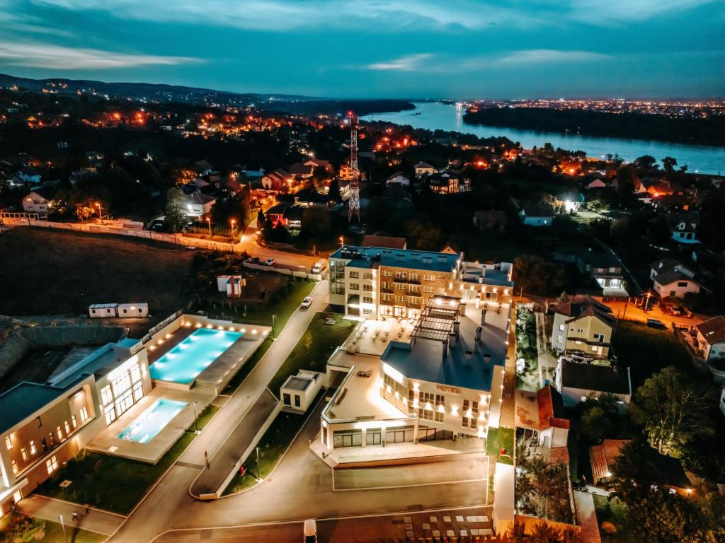 an aerial view of a city at night at Nordic Resort in Novi Sad