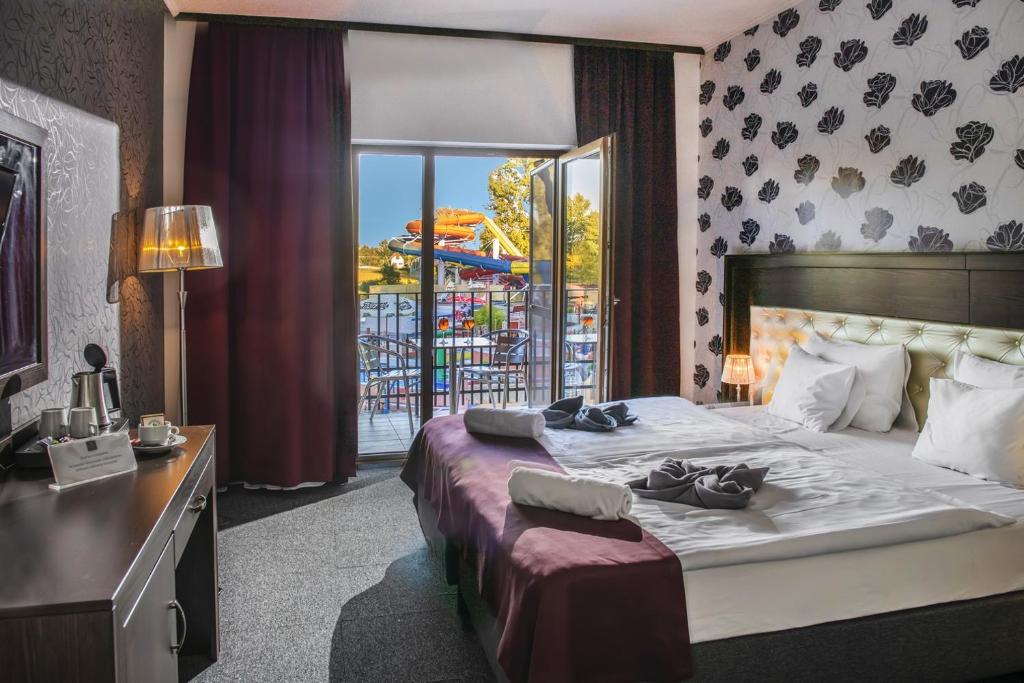 Postel nebo postele na pokoji v ubytování Session Hotel Ráckeve