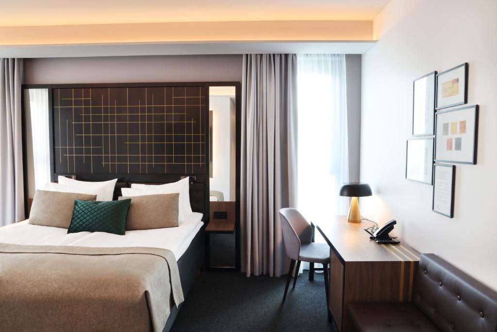 Postel nebo postele na pokoji v ubytování Hotel Reykjavík Saga