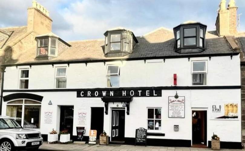 a white building with a crown hotel at The Crown Hotel in Inverbervie