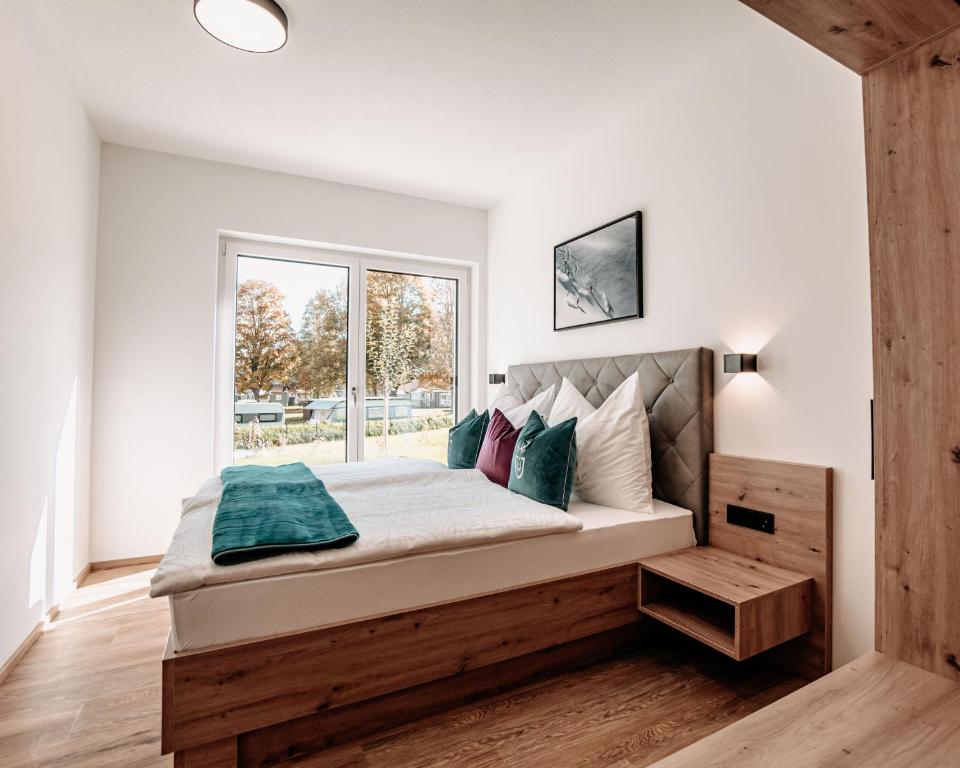 Postel nebo postele na pokoji v ubytování Tanners Chalet Apartments