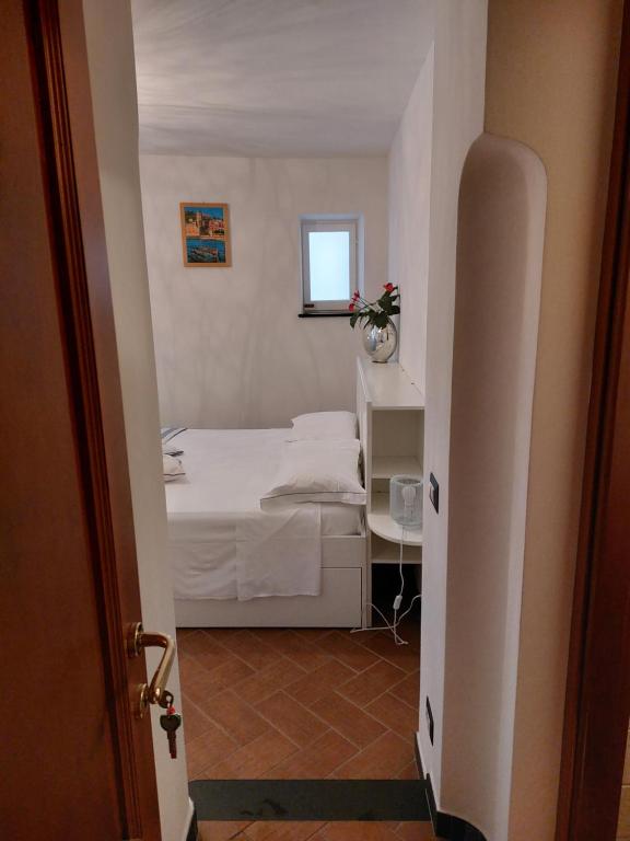 Postel nebo postele na pokoji v ubytování A cà di Bafirussi