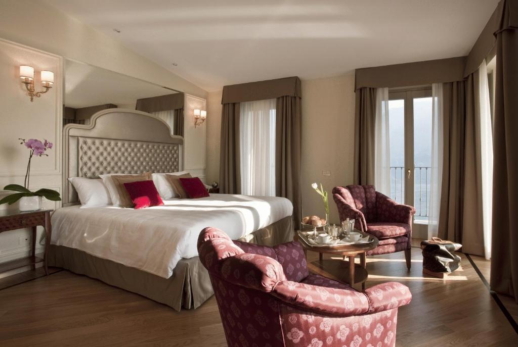 Postel nebo postele na pokoji v ubytování Hotel Villa Flori