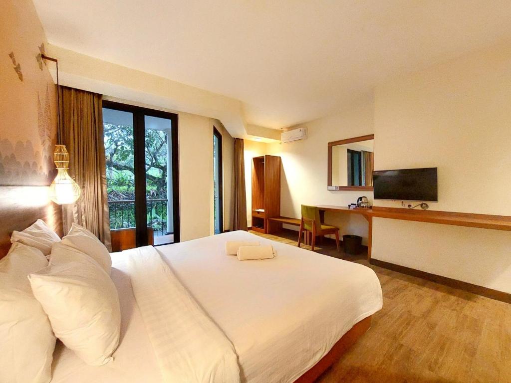 TV a/nebo společenská místnost v ubytování The Batu Hotel & Villas