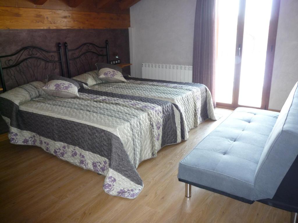A bed or beds in a room at Casa Rural Ezkibel by clabao