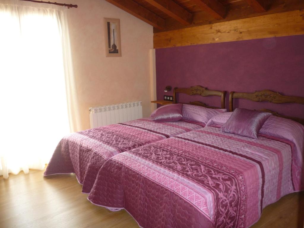 A bed or beds in a room at Casa Rural Ezkibel by clabao