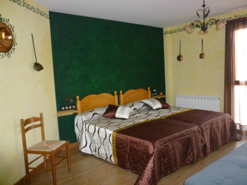 מיטה או מיטות בחדר ב-Casa Rural Ezkibel