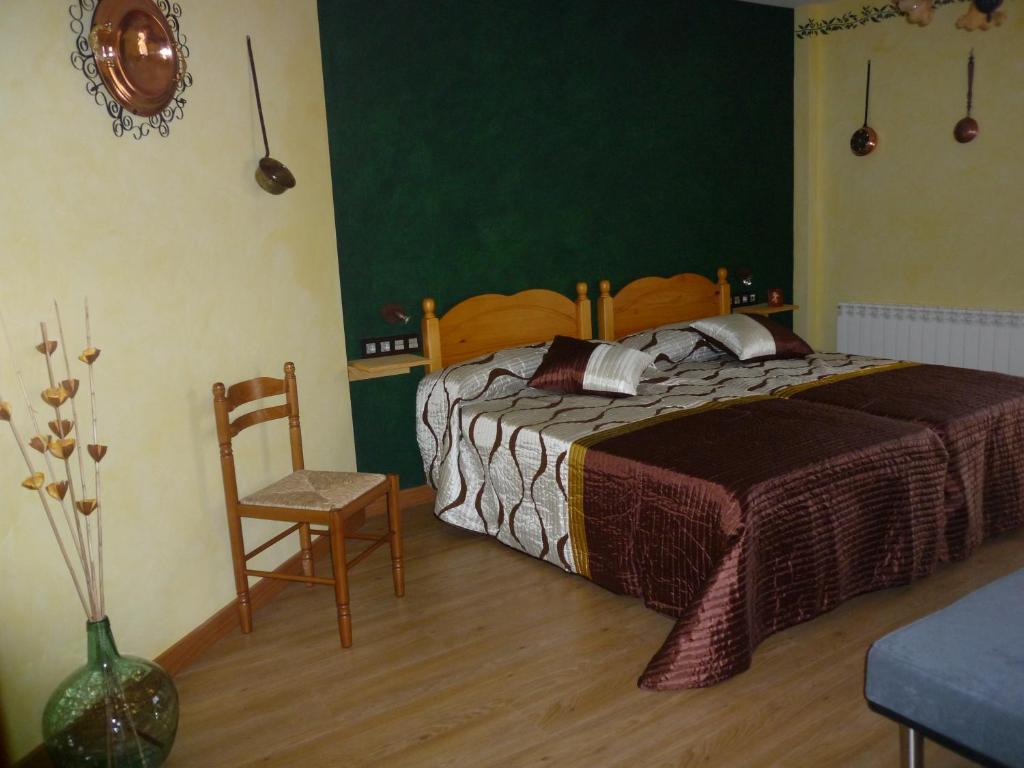 A bed or beds in a room at Casa Rural Ezkibel by clabao