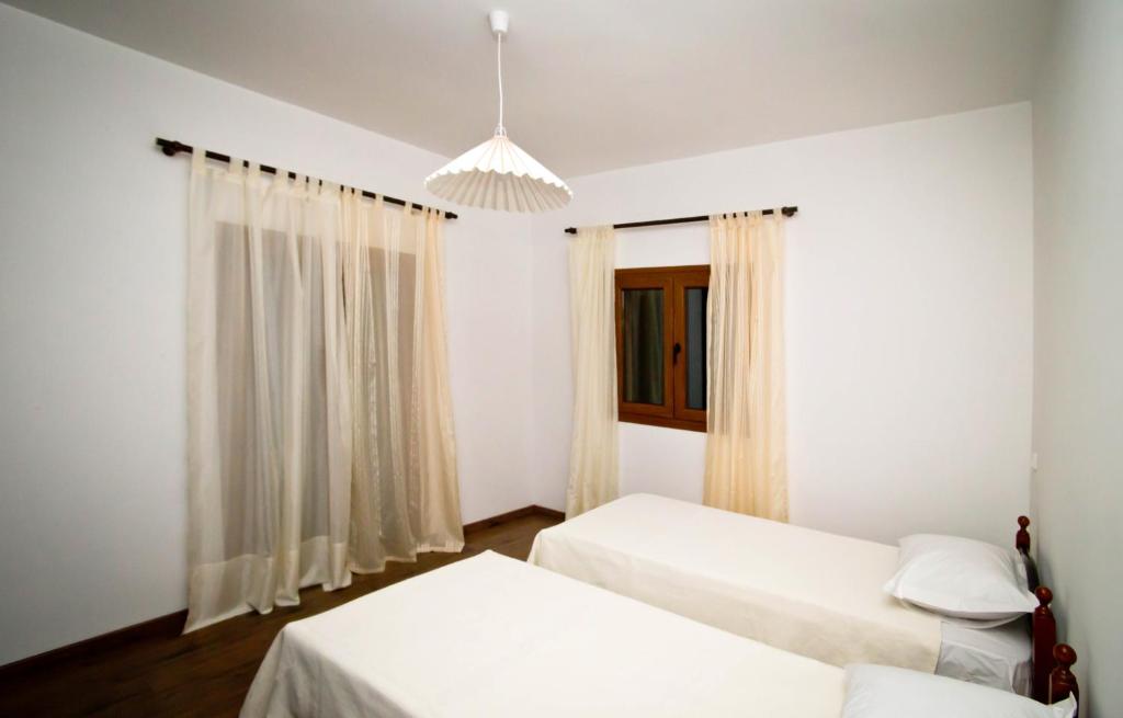 Postel nebo postele na pokoji v ubytování Persephone's Villa