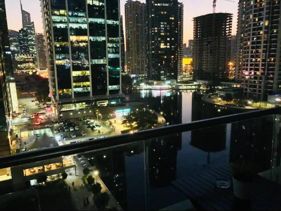 a view of a city skyline at night at Luxury Modern Studio in JLT with Amazing View & Rooftop Pool - sleeps 3 in Dubai