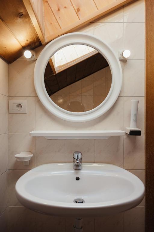 Koupelna v ubytování Hotel La Montanara Predazzo