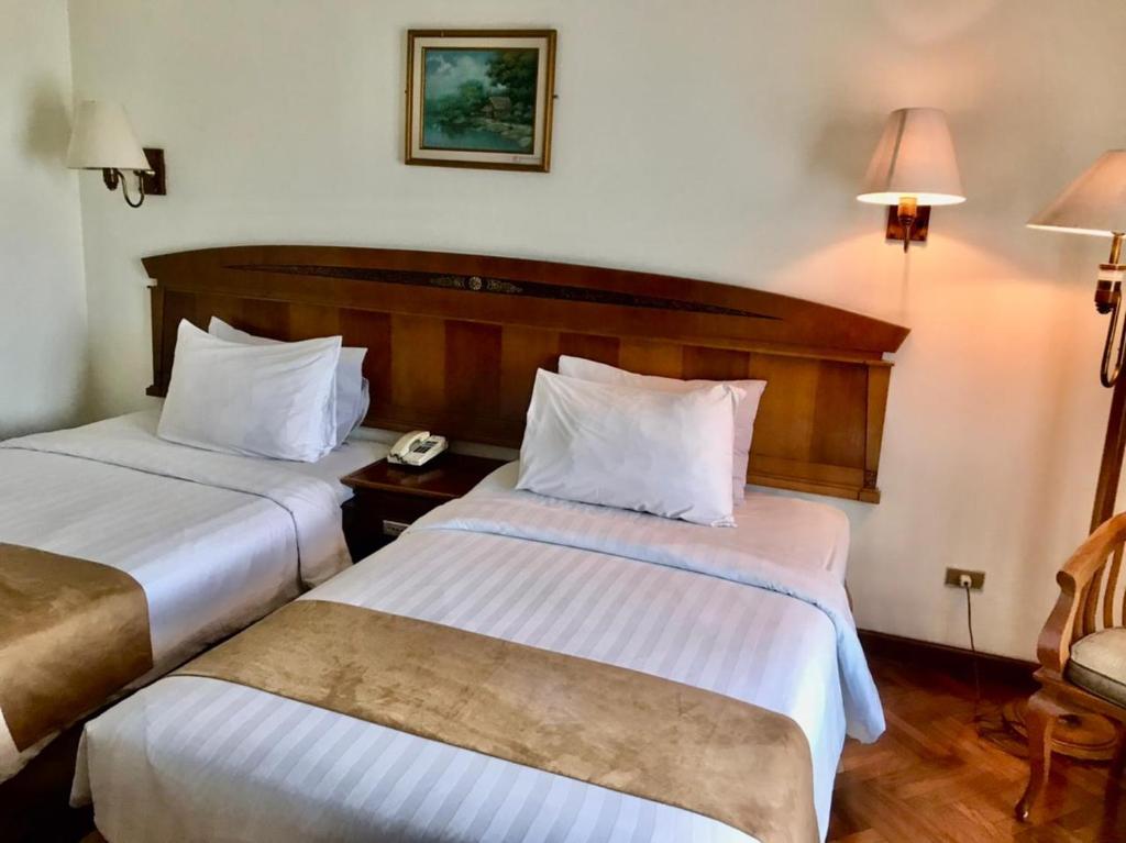 Postel nebo postele na pokoji v ubytování Hotel Kaisar