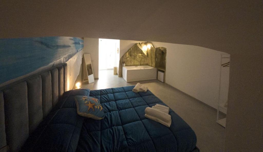 Postel nebo postele na pokoji v ubytování B&B suite anfiteatro Pozzuoli